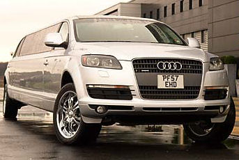 Chauffeur stretched silver Audi Q7 Sport limousine hire in London.