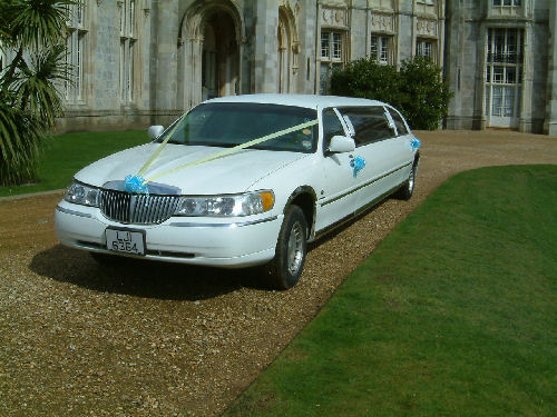 Chauffeur stretched white Lincoln limousine hire in London