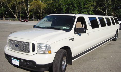 Chauffeur stretched white Ford Excursion 4x4 limo hire in UK