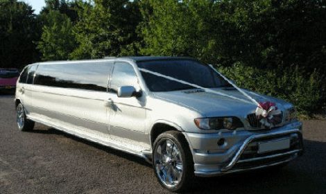 Chauffeur stretch silver BMW X5 limo hire in London.