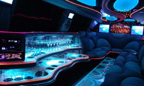 Chauffeur stretched Ford Excursion 4x4 limo hire interior in London.