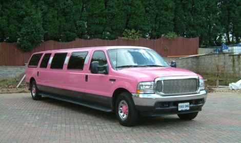Chauffeur stretched pink Lincoln Navigator limousine hire in London